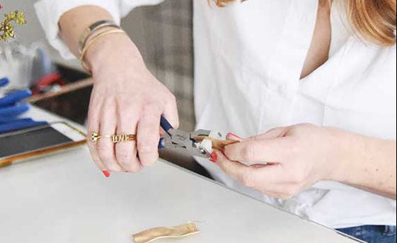 Kristin Hayes handcrafting jewelry in her Charlotte, North Carolina studio